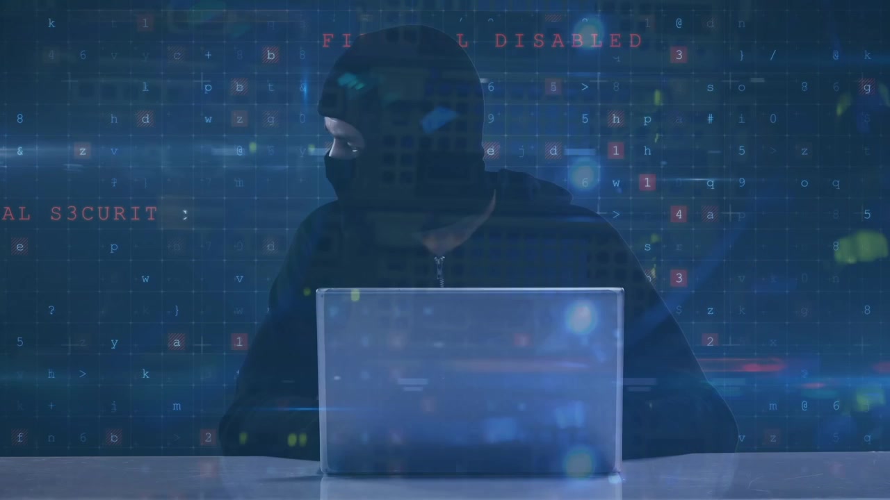 Animation of cyber attack text and data processing over hacker in balaklava with laptop