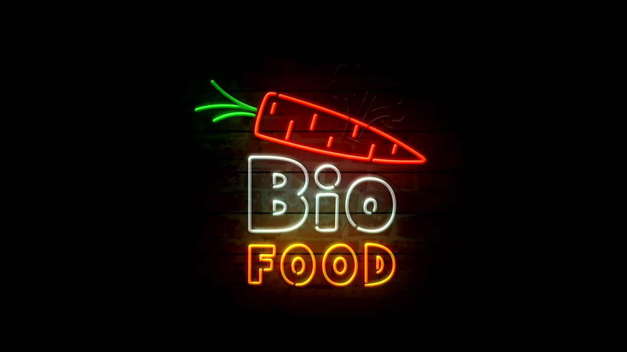 neón de alimentos biológicos en la pared de ladrillo