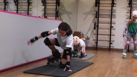 girls learning roller skating