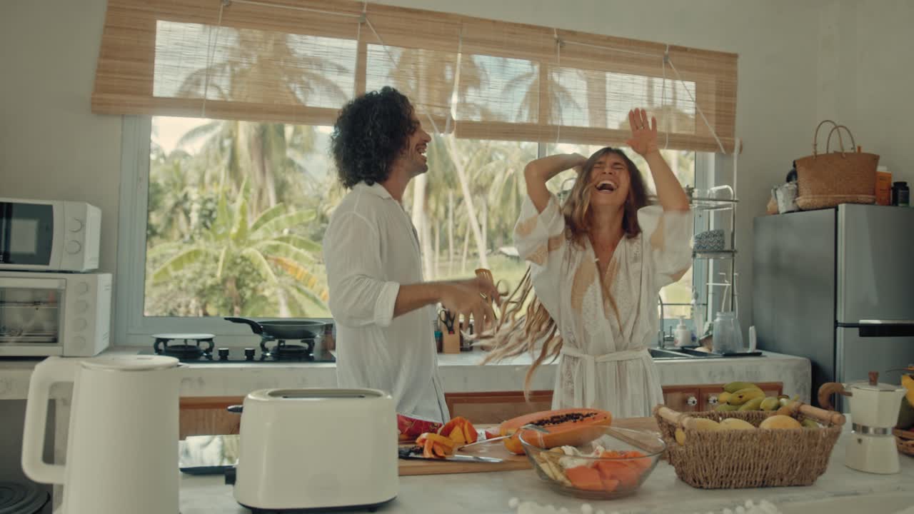 Couple Dancing in a Tropical Kitchen