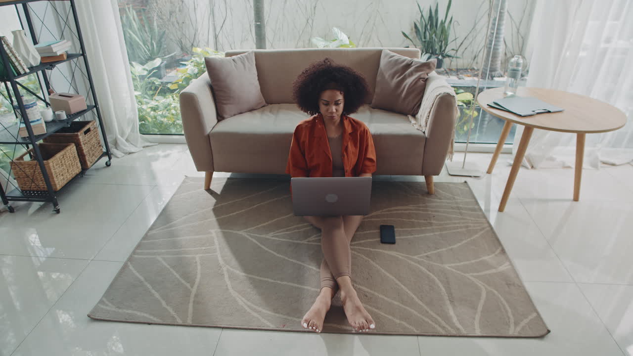 Hispanic Female Entrepreneur Using Wireless Computer Working from Home