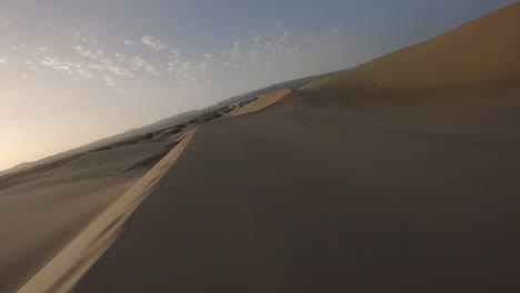 Fast-FPV-aerial-drone-flies-above-desert-sand-dunes-in-Desierto-Maspalomas