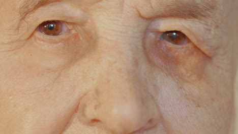 elderly womans face with tired expression