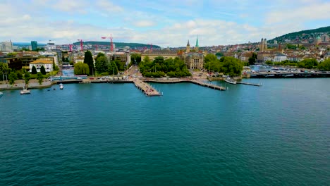 4K Drone Video of the Tour Boat Docks on Lake Zurich near Geiserbrunnen Monument Park in Downtown Zurich, Switzerland (High Speed)