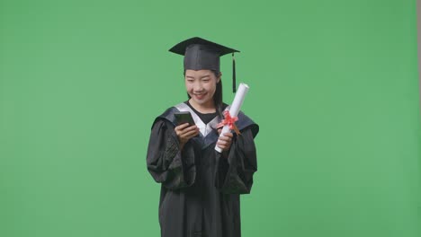 graduate with diploma and smartphone