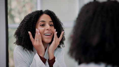 woman applying skin care cream