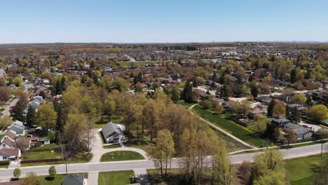 drone flying over small acton neighborhood in the spring