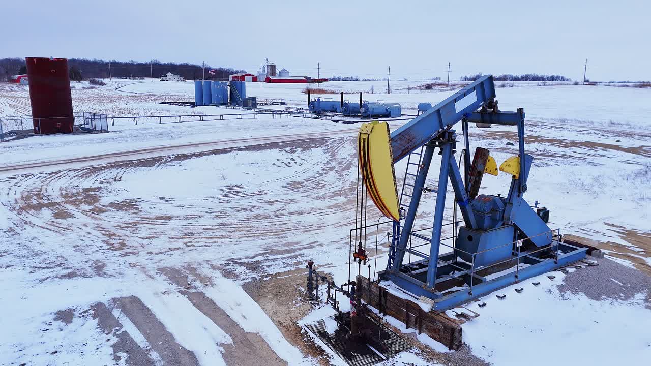 Pumpjack mechanism working to draw oil from the ground im southeast Michigan, USA