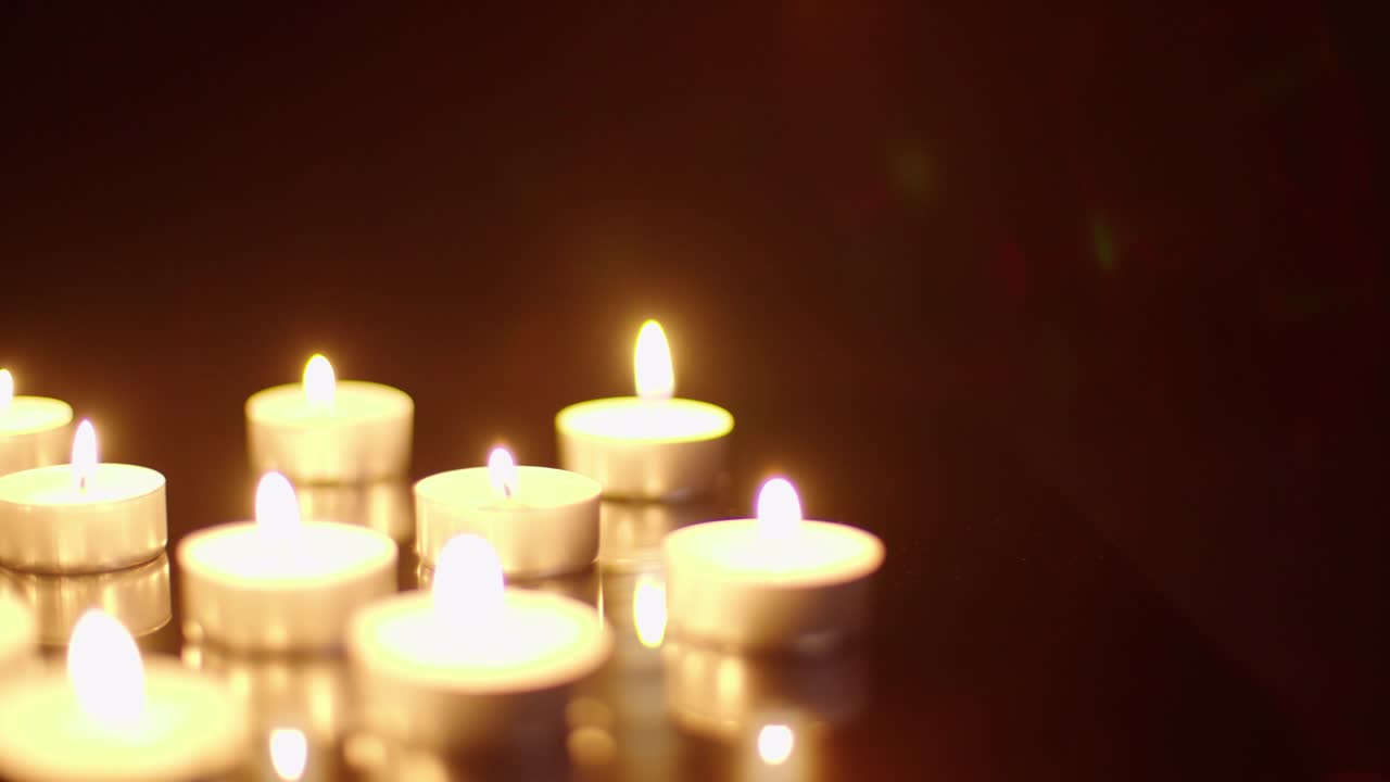 lighting a bunch of tea candlea rotating