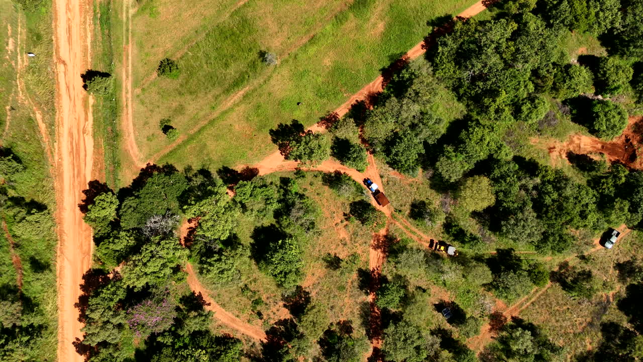 Machine working on the farm, aerial view of road repairs and machinery activity