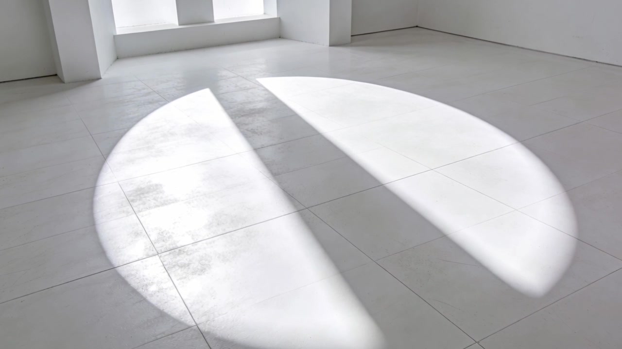 Shifting sunlight via 3 windows making bright patch on tile floor in white room, wedge shifting