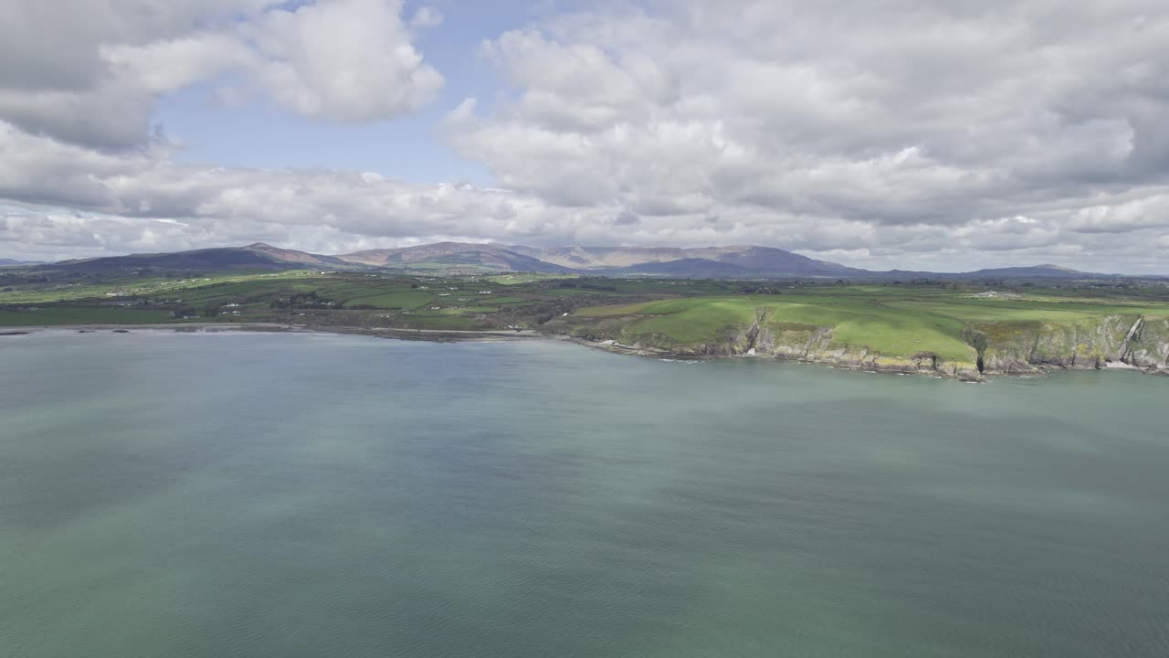 spring on the Copper Coast with the Comeragh Mountain Range and the lush green farmland of Co. Waterford