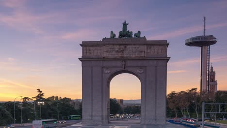 sunset in front of moncloa arch and faro de moncloa