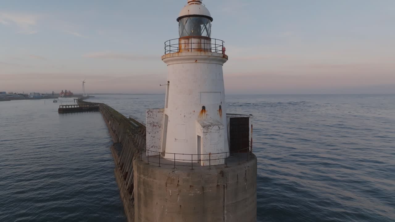 Stunning aerial visuals of Blyth Lighthouse set against the backdrop of a peaceful evening sky.