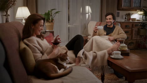 cozy evening at home with a couple and their cat