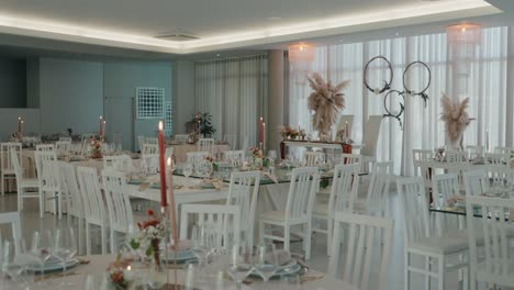 stylish wedding table setting with candles and flowers indoors