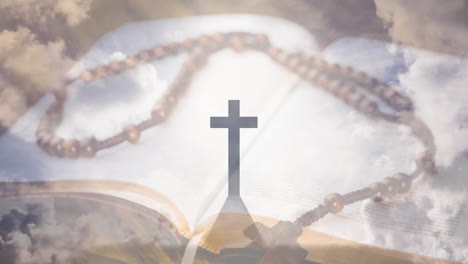 animation of christian cross, rosary and holy bible over clouds