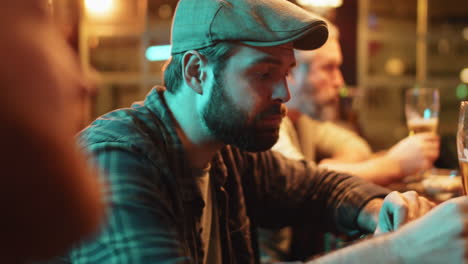 men drinking beer in gastropub