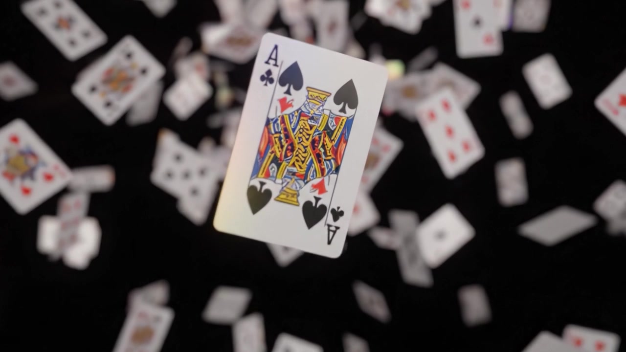 A Mesmerizing Cascade of Playing Cards in a Dazzling Display of Color and Motion, Capturing the Essence of Fun and Chance in a Vibrant Scene