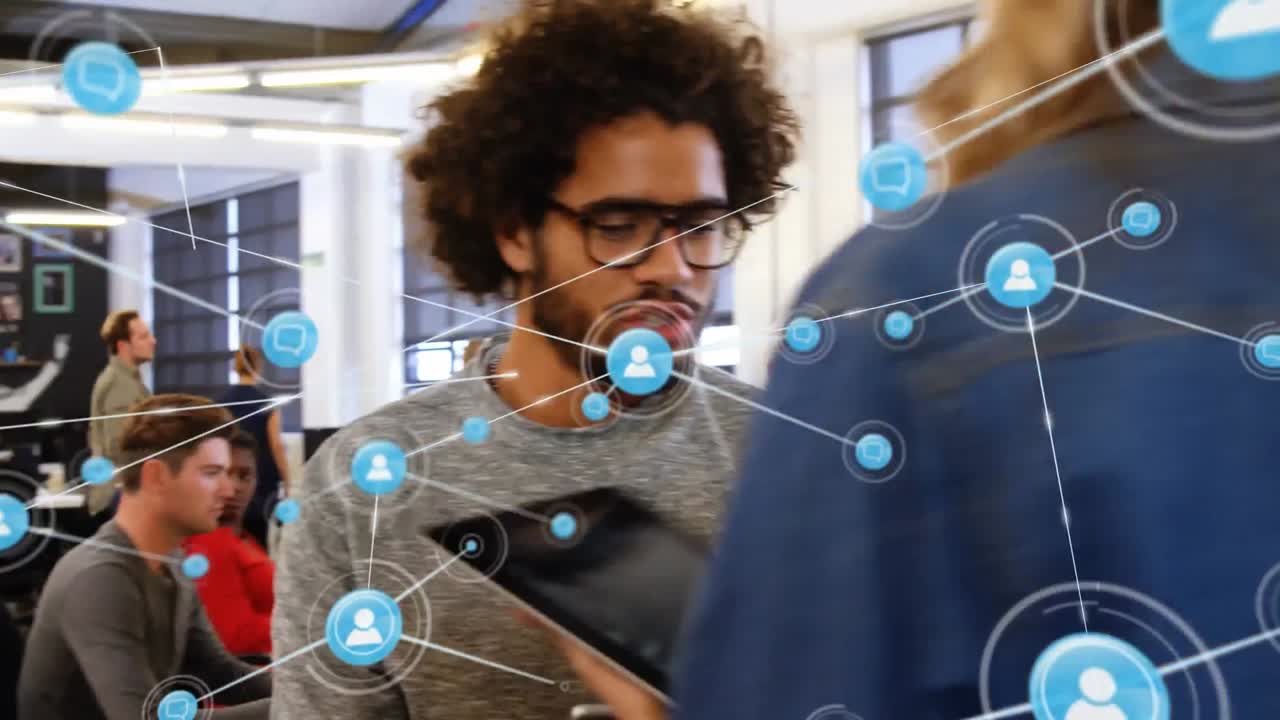 Network of connection icons against office colleagues discussing over digital tablet