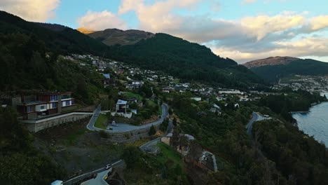 Aerial-orbit-estabilshing-Queenstown-New-Zealand-hidden-in-shade-of-mountain