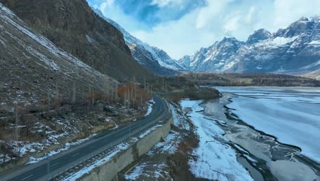 backward aerial shot of skardu landscape during morning in pakistan