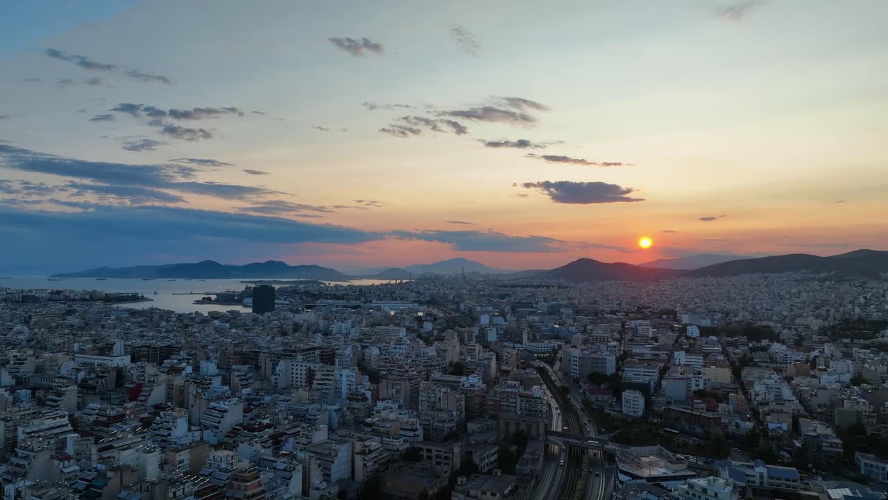 Sunset over Piraeus City, revealing the bustling port and vibrant cityscape bathed in golden light