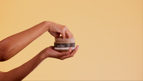 Hands,-product-and-skincare-with-body-scrub