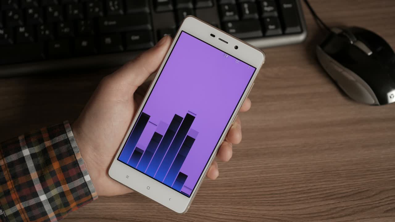 Man listens to music through the Internet. Listening to music on smart phone. Purple screen. Chroma key.  Pushing start stop of music app. Graphic equalizer .