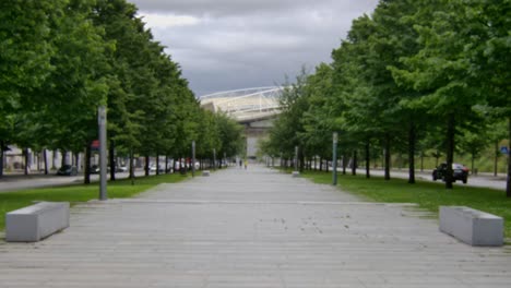 a walkpath downhill through a park or esplanade in porto, portugal