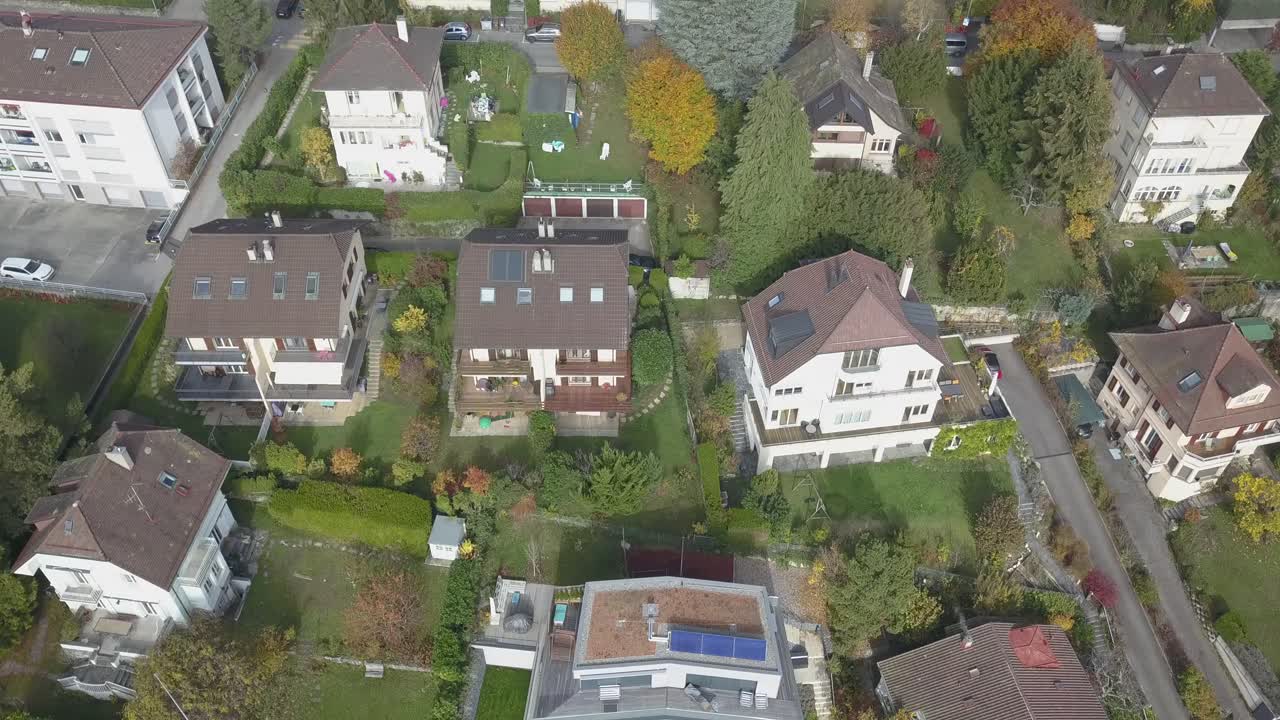 Lausanne, residential area in the town, houses with tile rooftops drone aerial view, urban environment, Switzerland, Vaud