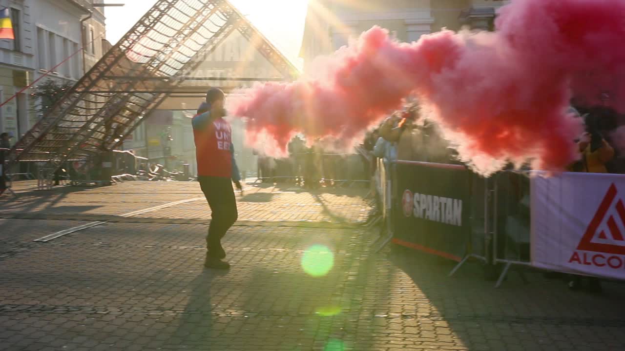 Large crowd of runners competing in the Spartan Race obstacle course, Slovakia