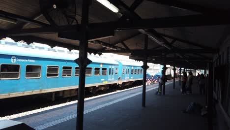 people waiting at a train station platform