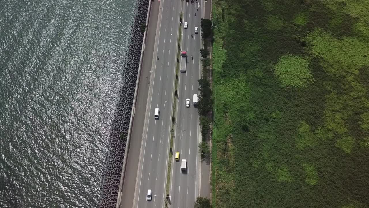 Traffic on Seaside Highway, Birdseye Aerial View. South Coastal Road, Cebu Island, Philippines