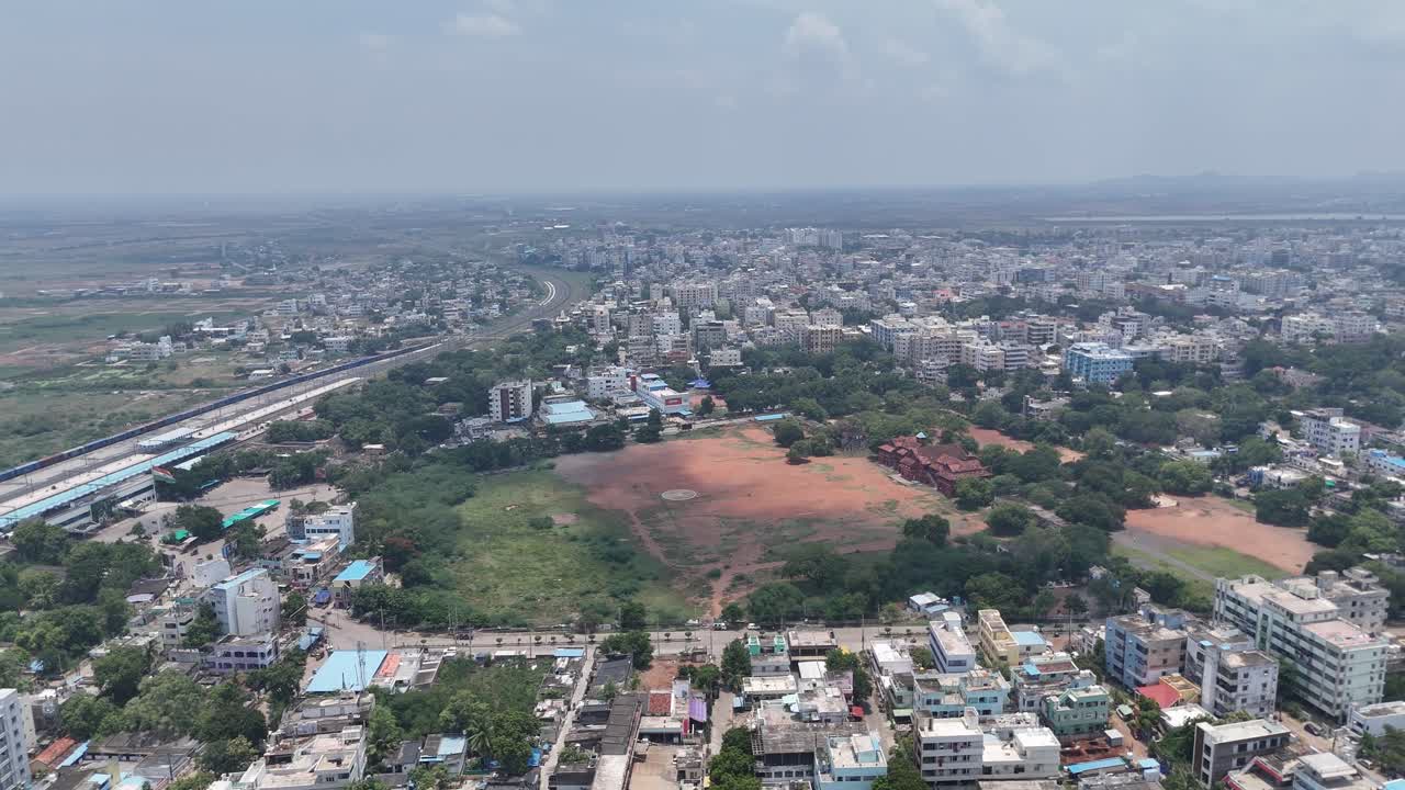 Beautiful drone view of Amaravathi’s peaceful rural road and green surroundings.