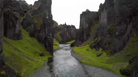 Fjadra-river-flowing-between-sharp-rock-Fjadrargljufur-canyon-cliffs