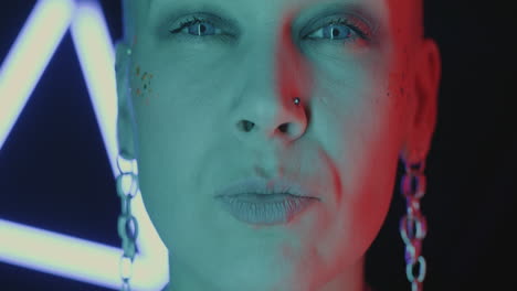 Close-up Portrait of a Woman with Bold Makeup and Neon Lighting