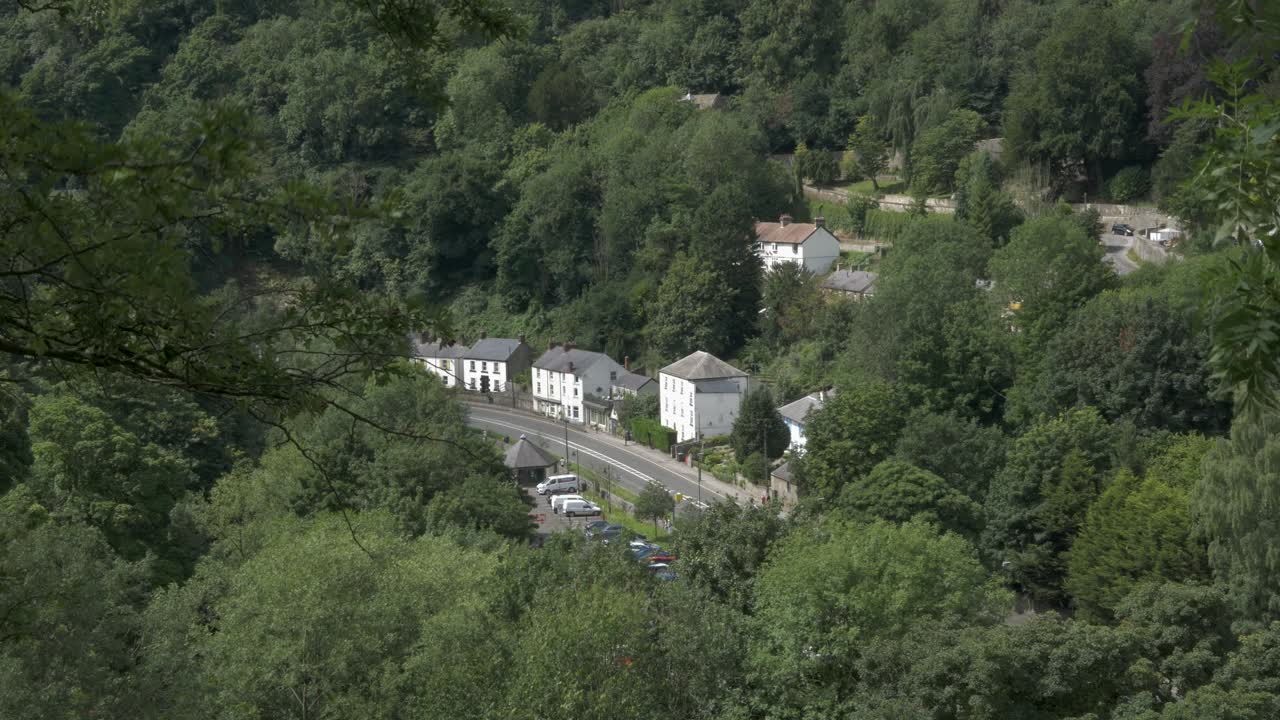 Birds eye view of traffic and houses in valley