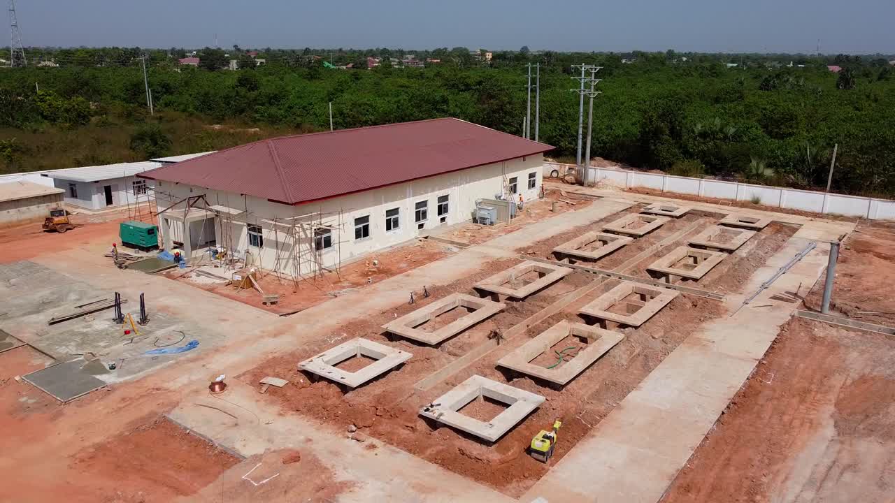 Control building and BESS area at photovoltaic power plant under construction. Renewable electric energy