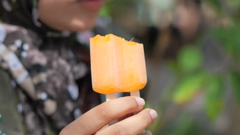 Young-women-eating-chocolate-flavor-ice-cream