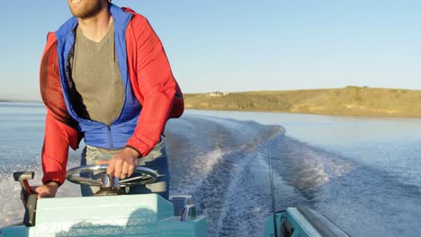 man riding motorboat in river 4k