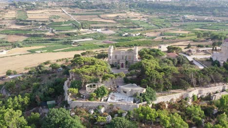 Aerial-View-Of-Hilltop-Tal-Virtu-Castle-Located-In-Rabat,-Malta