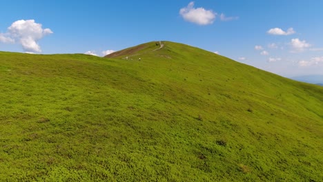 aerial flight over green hill mountains. fpv dynamic drone shot