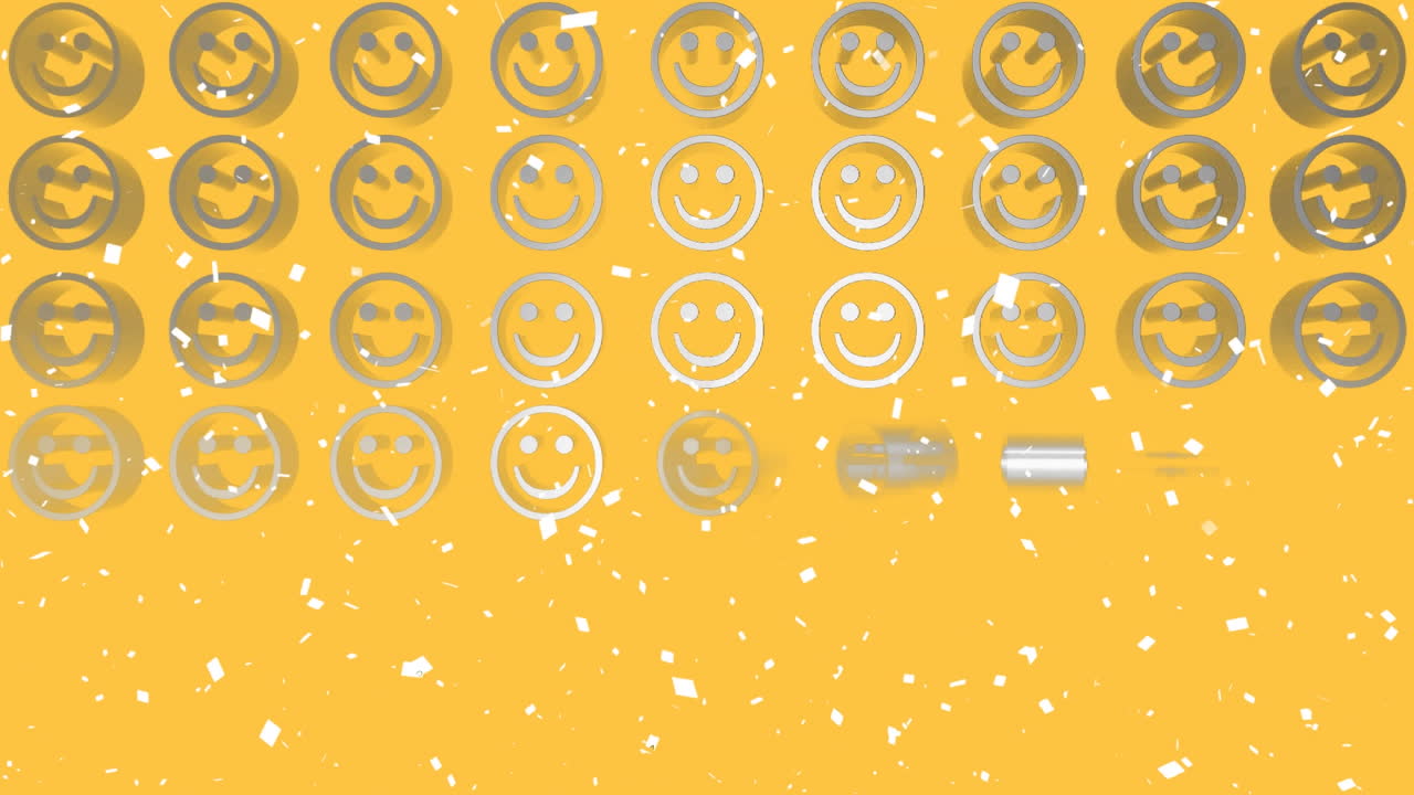 노란색 배경에 있는 금속 스마일리 얼굴 이모티의 줄에 떨어지는  ⁇  콘페티의 애니메이션