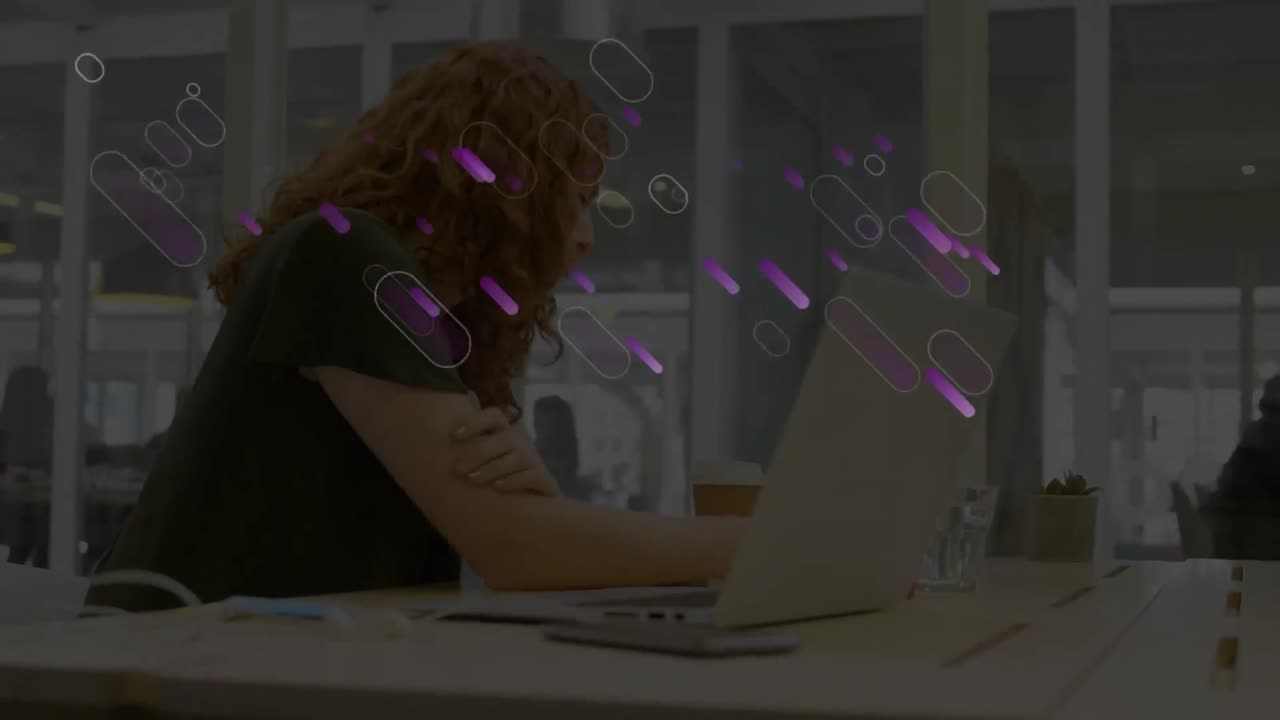 Animation of purple lights trails over businesswoman in office