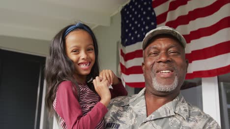 Video-of-happy-african-american-soldier-grandfather-and-granddaughter