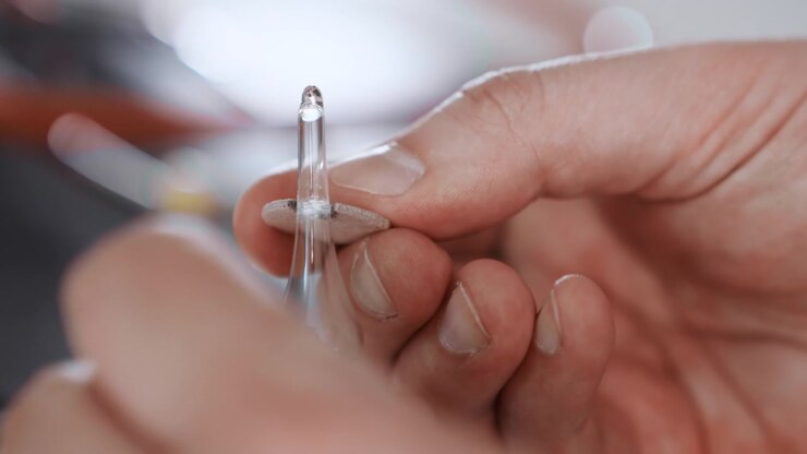 Hands steady with syringe ready. Emergency responder carefully primes medical needle. Healthcare professional expertly managing sterile injection preparation in urgent emergency situation