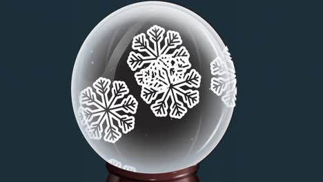 animation of snow globe with snowflakes falling on blue background