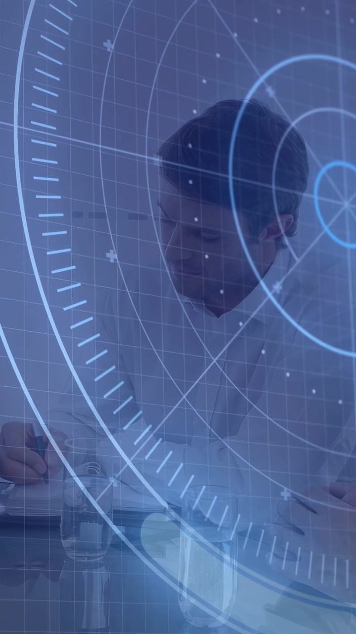 Man in white lab coat reviewing notes, colleague writing on pad activating HUD for clinical review