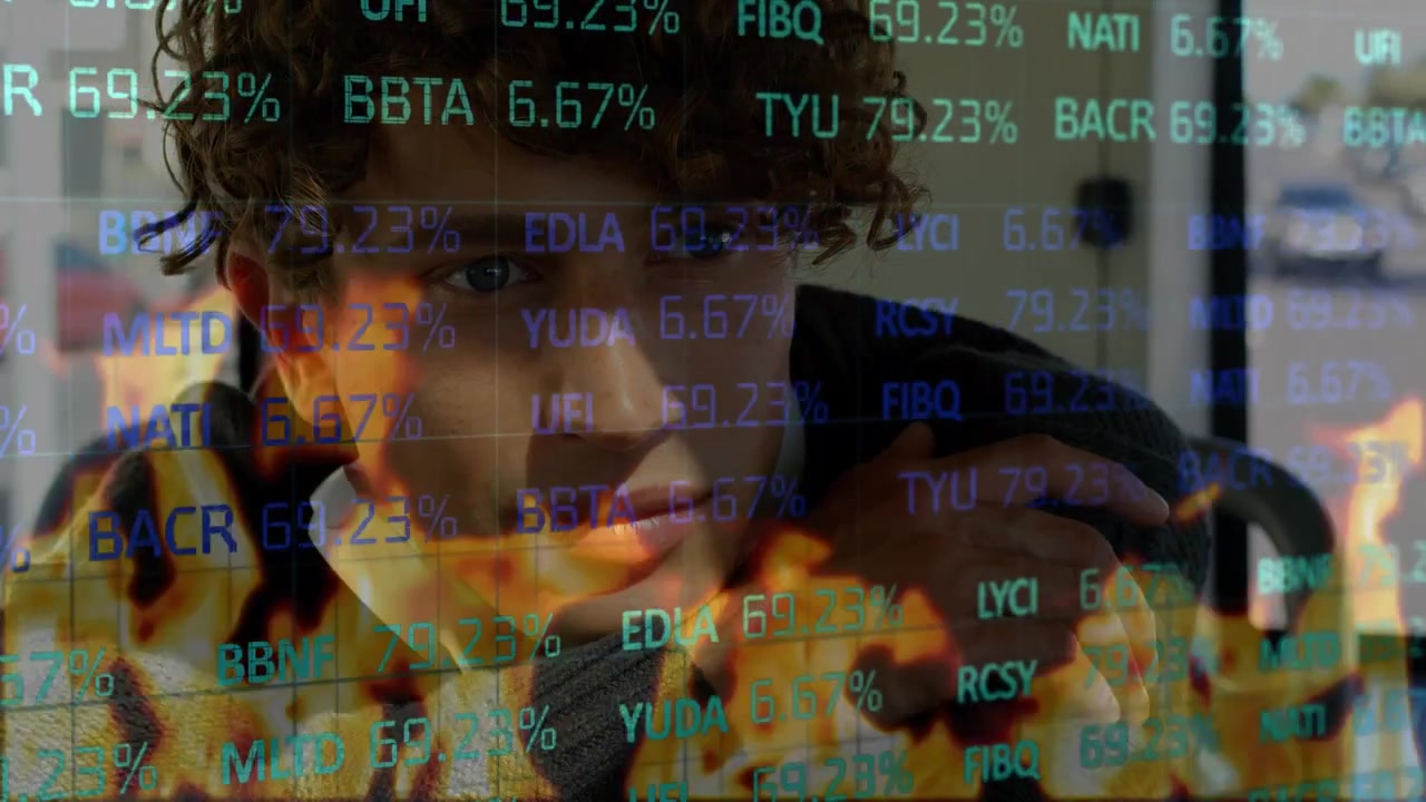 Animation of data processing and flames over caucasian man